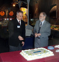 Kevin Pearson and James Hesser cut the cake